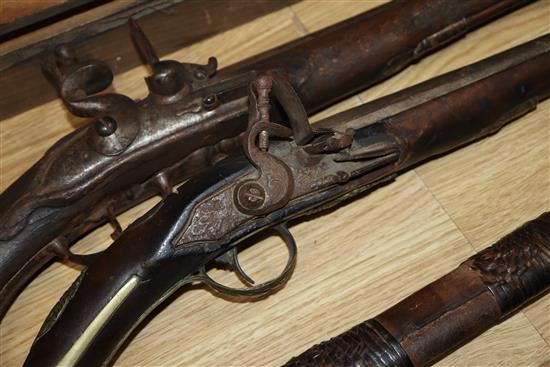 A Continental brass mounted flintlock pistol and another pistol and a rifle rifle 170cm